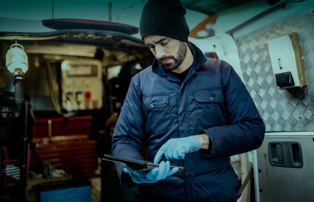 Electrician working behind his van