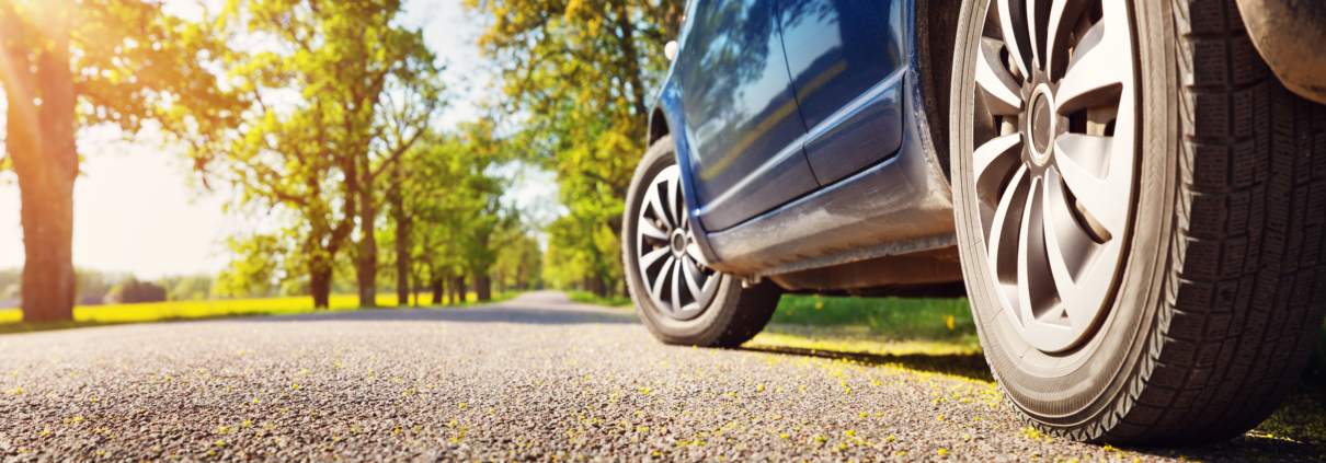 car driving on road in summer