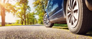 car driving on road in summer