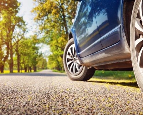 car driving on road in summer