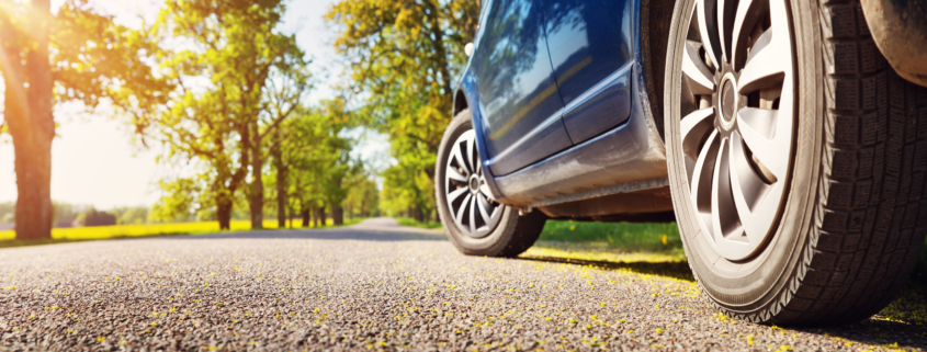 car driving on road in summer